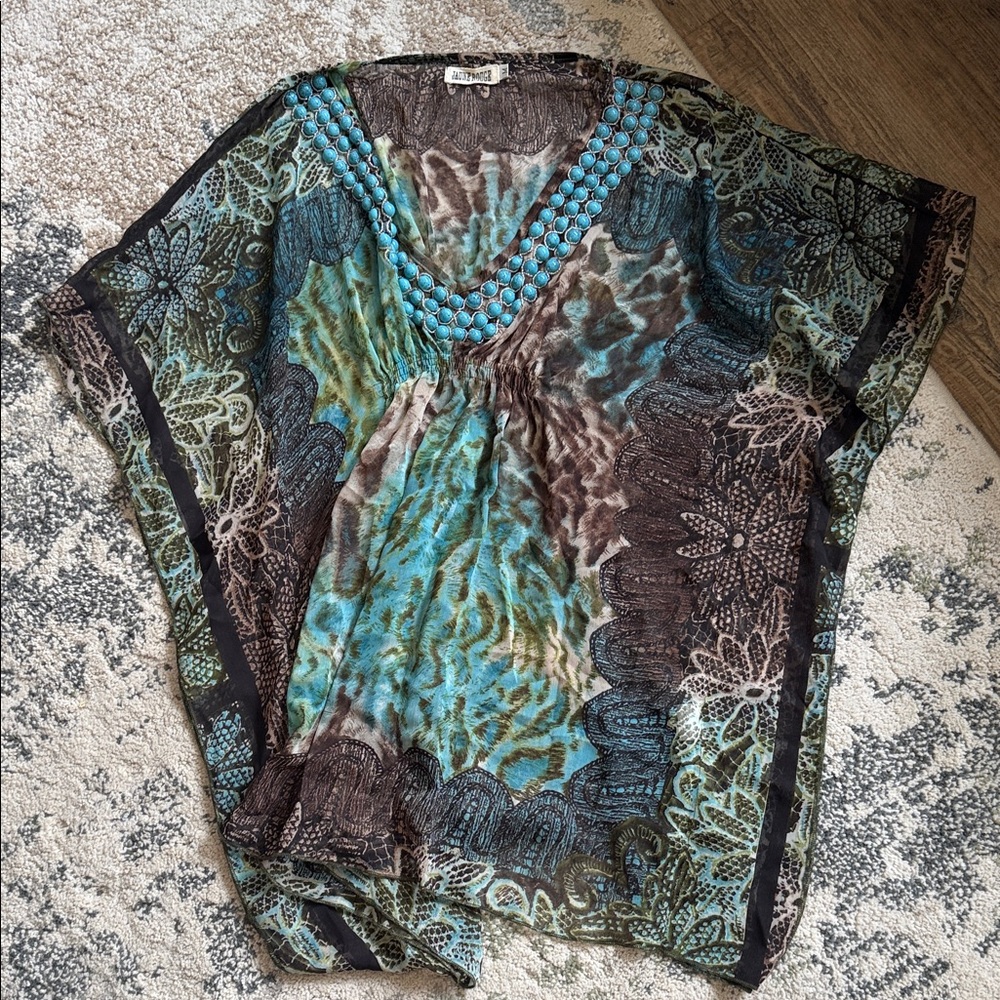 Elegant Sheer V-Neck Blouse with Intricate Patterns
